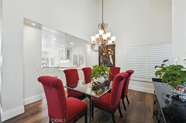14 Bridgewood Unit 22, Irvine, CA 92604 - dining room with dark wood-style floors, a chandelier, recessed lighting, and a high ceiling