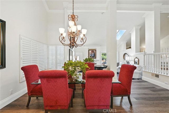 14 Bridgewood Unit 22, Irvine, CA 92604 - dining area featuring a chandelier, high vaulted ceiling, crown molding, wood finished floors, and a skylight