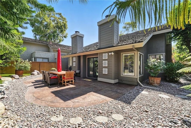 14 Bridgewood Unit 22, Irvine, CA 92604 - back of house featuring a chimney and a patio