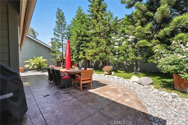 14 Bridgewood Unit 22, Irvine, CA 92604 - fenced backyard with a patio area and outdoor dining area
