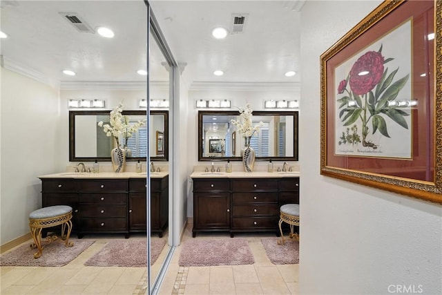 14 Bridgewood Unit 22, Irvine, CA 92604 - full bathroom featuring crown molding, double vanity, tile patterned flooring, and recessed lighting