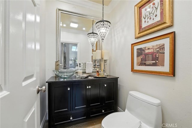 14 Bridgewood Unit 22, Irvine, CA 92604 - half bathroom with vanity, crown molding, a chandelier, and decorative backsplash