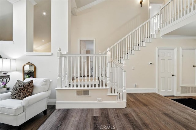 14 Bridgewood Unit 22, Irvine, CA 92604 - stairway with wood finished floors, a towering ceiling, and crown molding