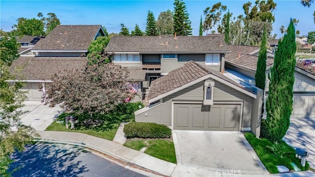 14 Bridgewood Unit 22, Irvine, CA 92604 - traditional-style house with driveway and an attached garage