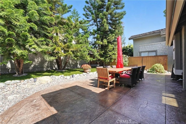 14 Bridgewood Unit 22, Irvine, CA 92604 - fenced backyard with a patio and outdoor dining space