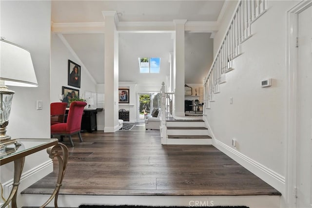 14 Bridgewood Unit 22, Irvine, CA 92604 - foyer with stairway, a high ceiling, wood finished floors, decorative columns, and crown molding