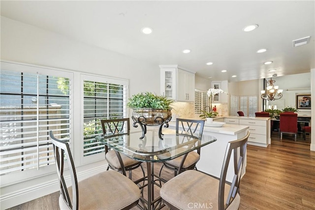 14 Bridgewood Unit 22, Irvine, CA 92604 - dining space with a chandelier, wood finished floors, and recessed lighting