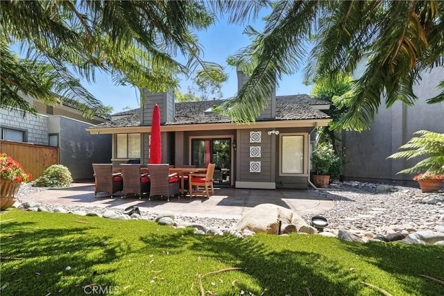 14 Bridgewood Unit 22, Irvine, CA 92604 - rear view of property featuring a patio area and a chimney