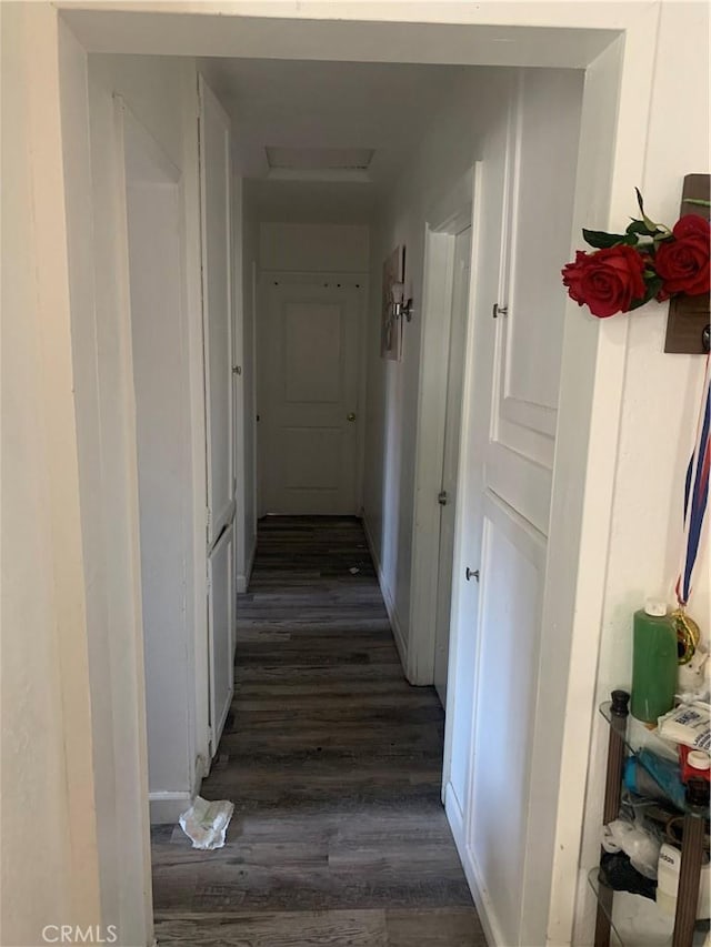 22315 Ibex Ave, Hawaiian Gardens, CA 90716 - corridor with dark wood-style floors and attic access