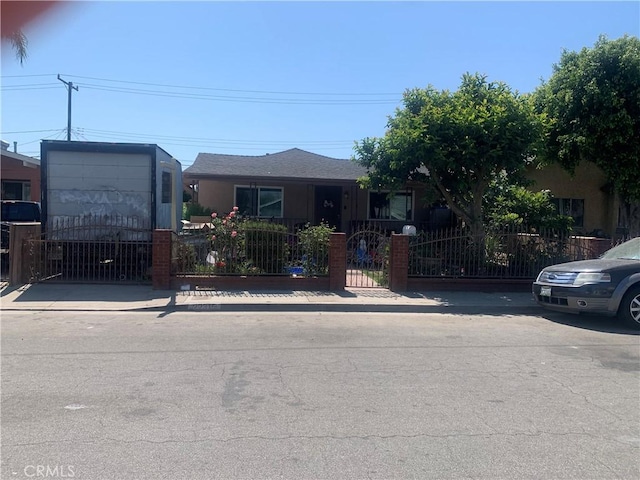 22315 Ibex Ave, Hawaiian Gardens, CA 90716 - view of front facade with a fenced front yard and a gate