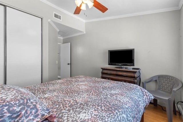 817 Granite Privado, Ontario, CA 91762 - bedroom with a closet, wood finished floors, ornamental molding, and ceiling fan