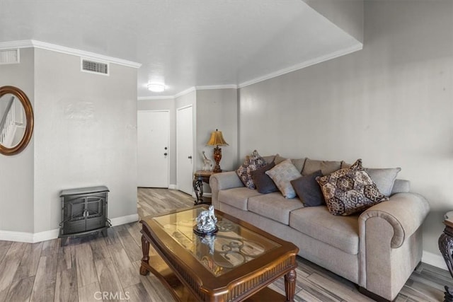 817 Granite Privado, Ontario, CA 91762 - living area with a wood stove, wood finished floors, and crown molding