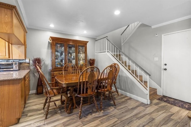 817 Granite Privado, Ontario, CA 91762 - dining area with light wood finished floors, stairs, crown molding, and recessed lighting