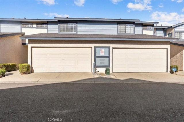 817 Granite Privado, Ontario, CA 91762 - view of front of house featuring stucco siding and concrete driveway