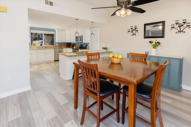 24093 Sargeant Rd, Ramona, CA 92065 - dining area featuring ceiling fan and light wood finished floors