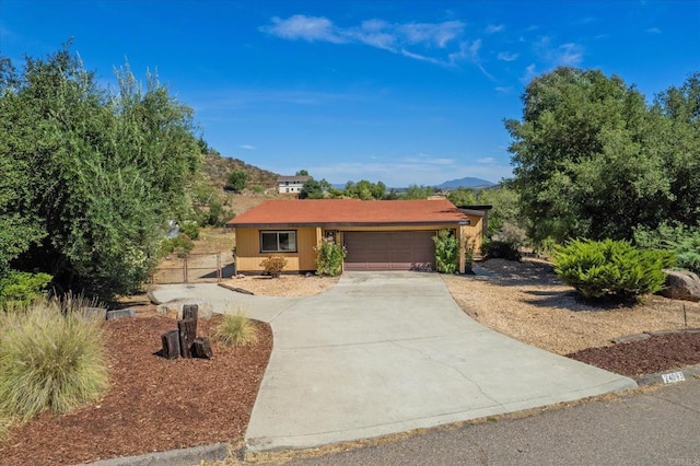 24093 Sargeant Rd, Ramona, CA 92065 - ranch-style home featuring a garage, driveway, and a mountain view