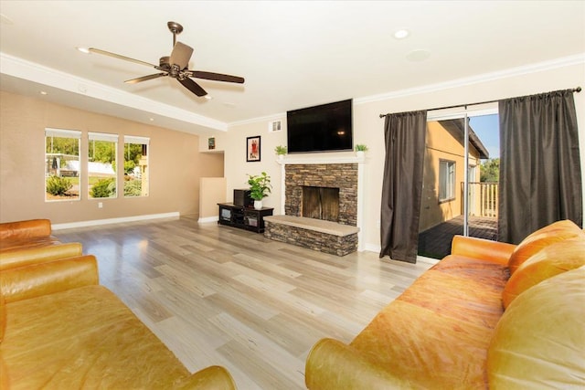 24093 Sargeant Rd, Ramona, CA 92065 - living area featuring healthy amount of natural light, a stone fireplace, wood finished floors, vaulted ceiling, and ornamental molding