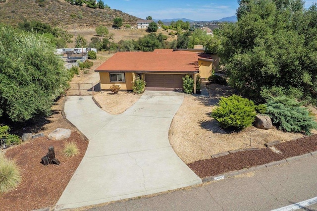 24093 Sargeant Rd, Ramona, CA 92065 - single story home with concrete driveway, a mountain view, an attached garage, and a gate