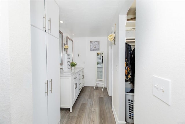24093 Sargeant Rd, Ramona, CA 92065 - corridor featuring light wood finished floors and recessed lighting
