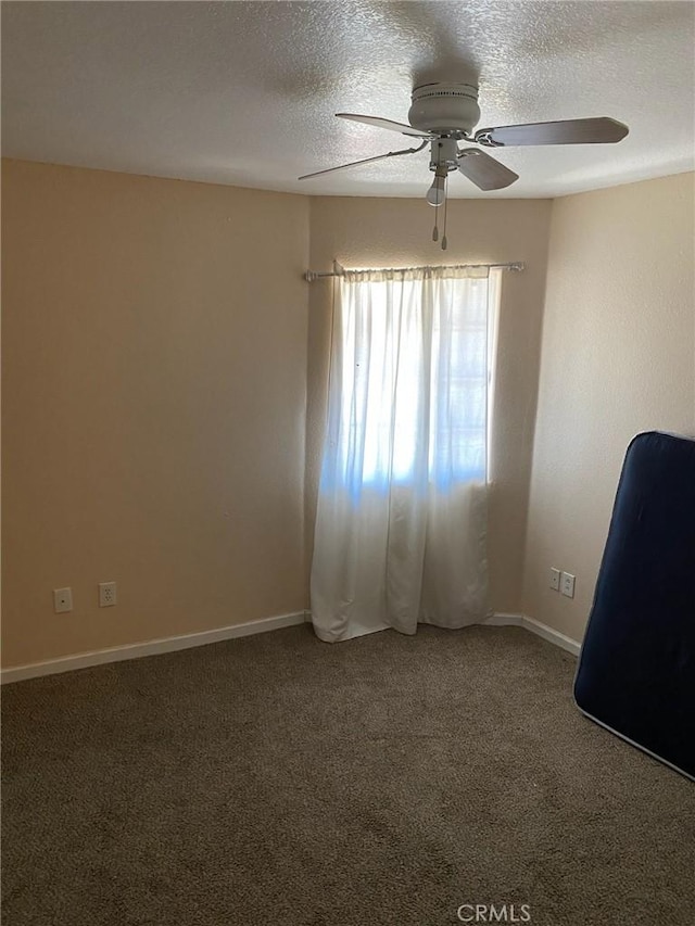 755 N Allen St, Banning, CA 92220 - empty room with a ceiling fan, a textured ceiling, and carpet floors