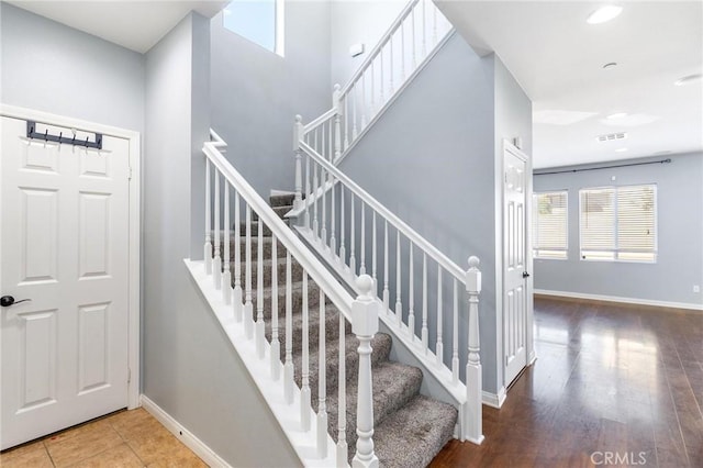 43024 Beamer Ct, Temecula, CA 92592 - stairs featuring healthy amount of natural light, recessed lighting, and wood finished floors
