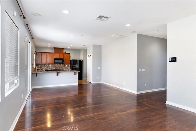 43024 Beamer Ct, Temecula, CA 92592 - unfurnished living room with recessed lighting, dark wood-style flooring, and a barn door