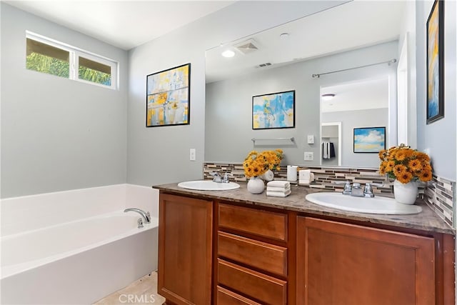 43024 Beamer Ct, Temecula, CA 92592 - bathroom featuring double vanity, backsplash, and a garden tub