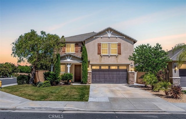 43024 Beamer Ct, Temecula, CA 92592 - view of front facade featuring stucco siding, driveway, stone siding, and an attached garage