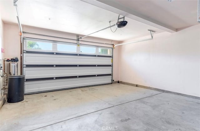 43024 Beamer Ct, Temecula, CA 92592 - garage featuring baseboards and a garage door opener