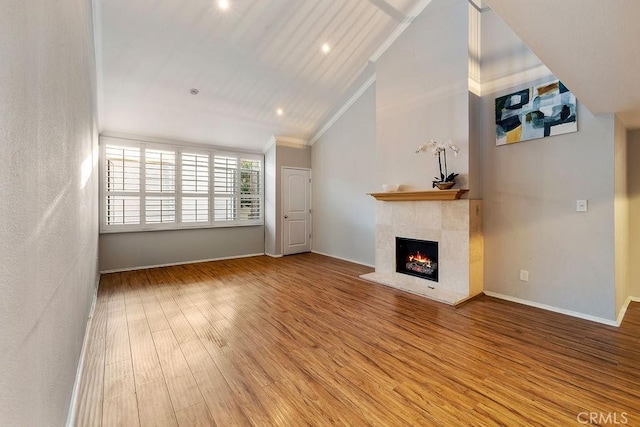 5325 Newcastle Ave Unit 319, Encino, CA 91316 - unfurnished living room with lofted ceiling, a fireplace, crown molding, wood finished floors, and recessed lighting