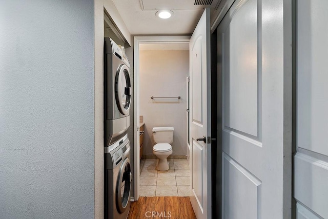 5325 Newcastle Ave Unit 319, Encino, CA 91316 - bathroom featuring stacked washer / drying machine and toilet