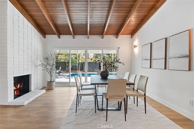 4701 Deseret Dr, Woodland Hills, CA 91364 - dining area with wooden ceiling, a brick fireplace, and wood finished floors