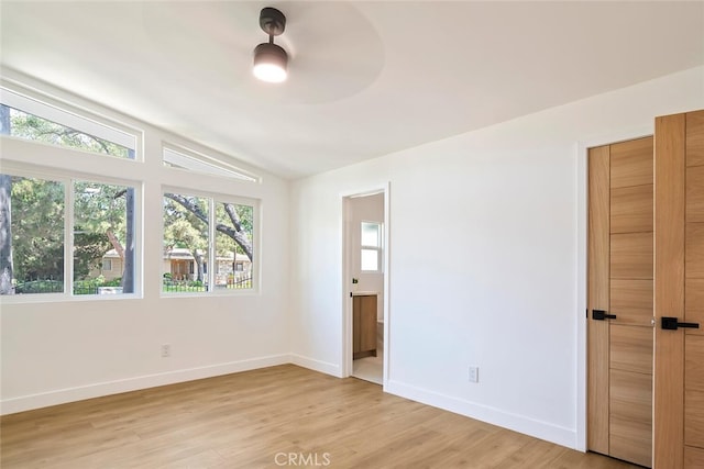 4701 Deseret Dr, Woodland Hills, CA 91364 - unfurnished bedroom with vaulted ceiling, light wood-style flooring, and ensuite bathroom