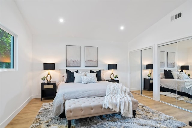 4701 Deseret Dr, Woodland Hills, CA 91364 - bedroom featuring multiple closets, lofted ceiling, light wood-style floors, and recessed lighting