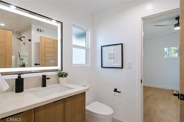 4701 Deseret Dr, Woodland Hills, CA 91364 - bathroom with healthy amount of natural light, vanity, wood finished floors, and a shower