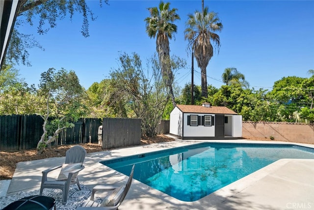 4701 Deseret Dr, Woodland Hills, CA 91364 - view of pool with a patio, a fenced backyard, and an outbuilding