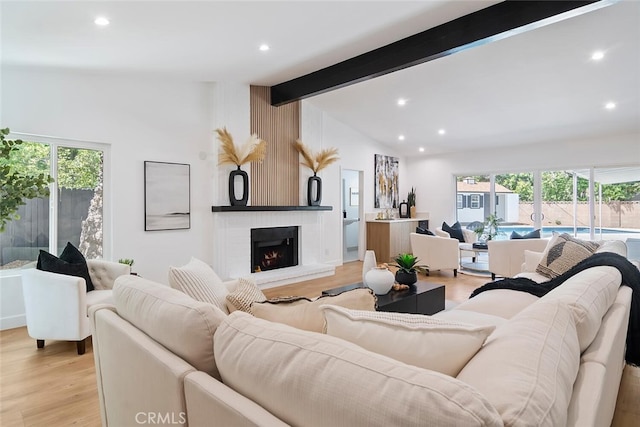 4701 Deseret Dr, Woodland Hills, CA 91364 - living room with recessed lighting, light wood-style floors, and a brick fireplace