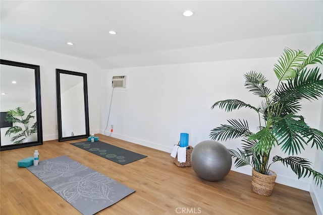 4701 Deseret Dr, Woodland Hills, CA 91364 - exercise area featuring wood finished floors, recessed lighting, and a wall mounted air conditioner