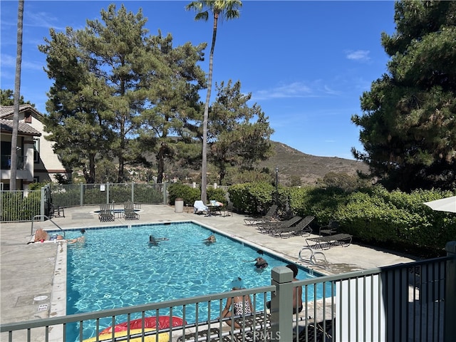 10824 Sabre Hill Dr Unit 194, San Diego, CA 92128 - community pool with a patio and a mountain view