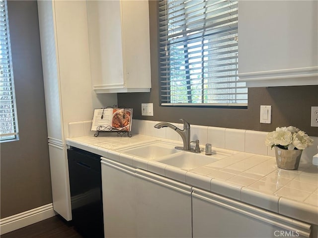 10824 Sabre Hill Dr Unit 194, San Diego, CA 92128 - kitchen featuring white cabinets, dishwasher, and tile counters