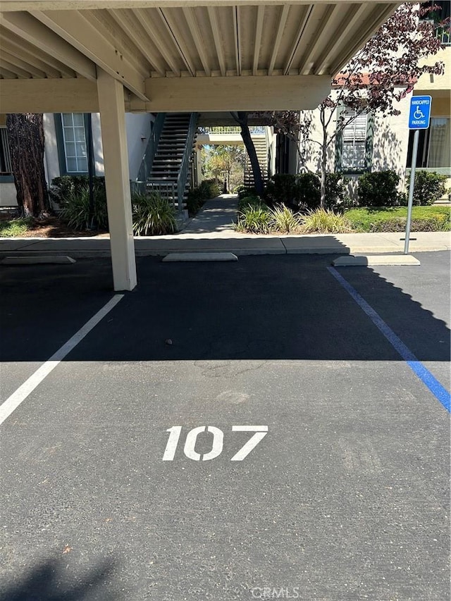 10824 Sabre Hill Dr Unit 194, San Diego, CA 92128 - covered parking lot featuring stairway