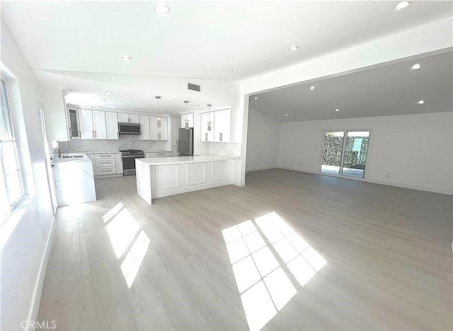 21541 Yucatan Ave, Woodland Hills, CA 91364 - unfurnished living room with recessed lighting and light wood-type flooring