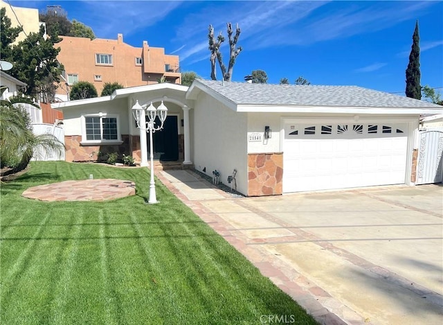 21541 Yucatan Ave, Woodland Hills, CA 91364 - view of front of property with an attached garage, a front lawn, driveway, stucco siding, and stone siding