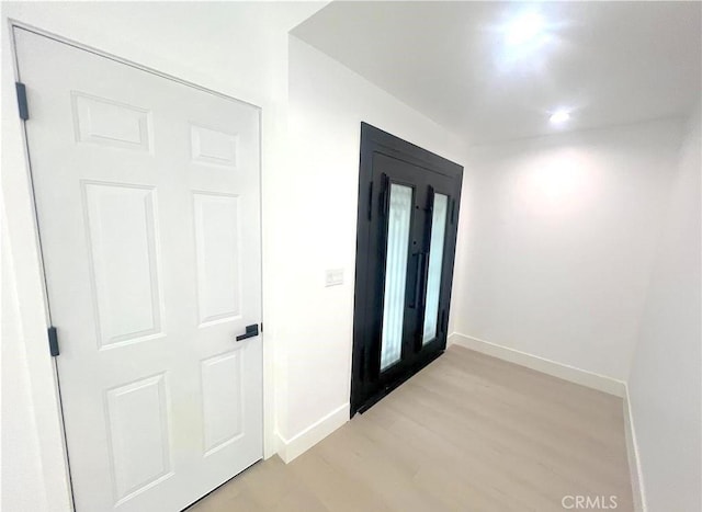 21541 Yucatan Ave, Woodland Hills, CA 91364 - entrance foyer with baseboards and light wood-style floors