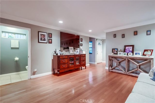 2975 Fernwood Ave, Lynwood, CA 90262 - living area featuring light wood-style floors, recessed lighting, and ornamental molding