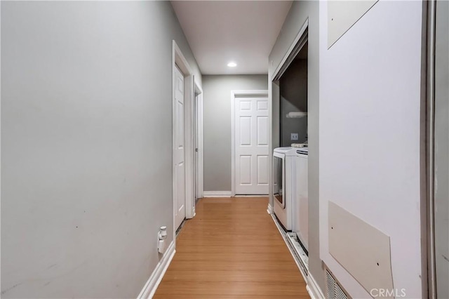 2975 Fernwood Ave, Lynwood, CA 90262 - hall featuring separate washer and dryer, light wood-type flooring, and recessed lighting