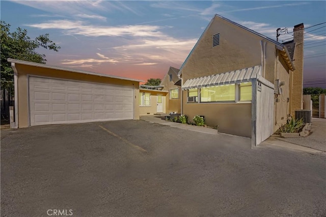 9720 Live Oak Ave, Temple City, CA 91780 - view of front of house with stucco siding, a detached garage, and a chimney
