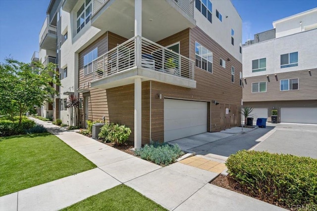 2013 Bravo Loop Unit 2, Chula Vista, CA 91915 - view of building exterior with an attached garage and concrete driveway