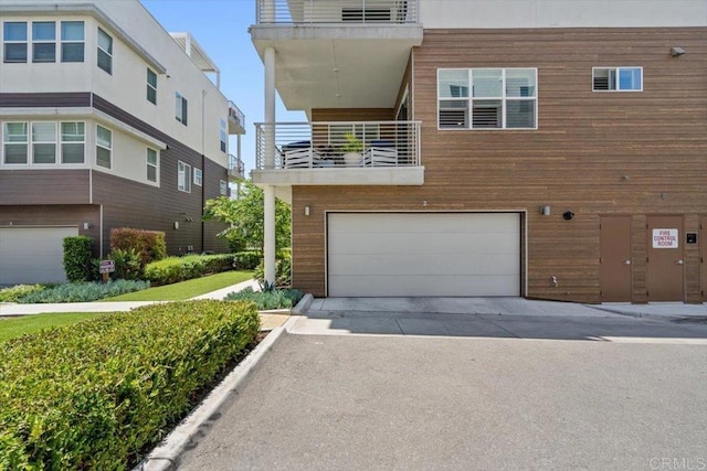 2013 Bravo Loop Unit 2, Chula Vista, CA 91915 - contemporary home featuring a balcony, an attached garage, and driveway