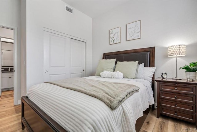 2013 Bravo Loop Unit 2, Chula Vista, CA 91915 - bedroom featuring a closet and light wood-type flooring